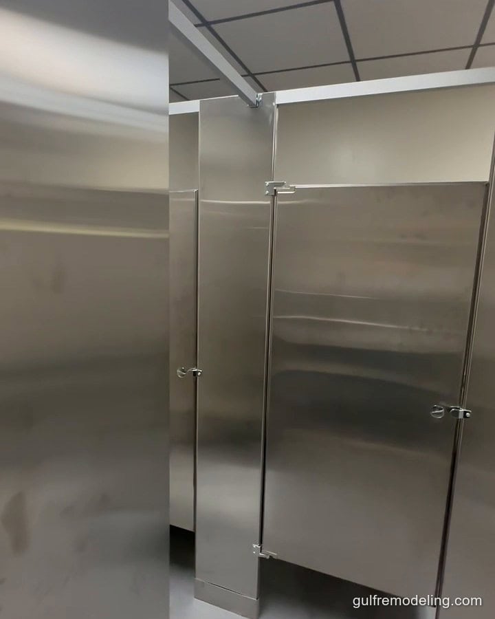 Commercial restroom after the remodel: new floor, ceiling and stainless stalls - Houston