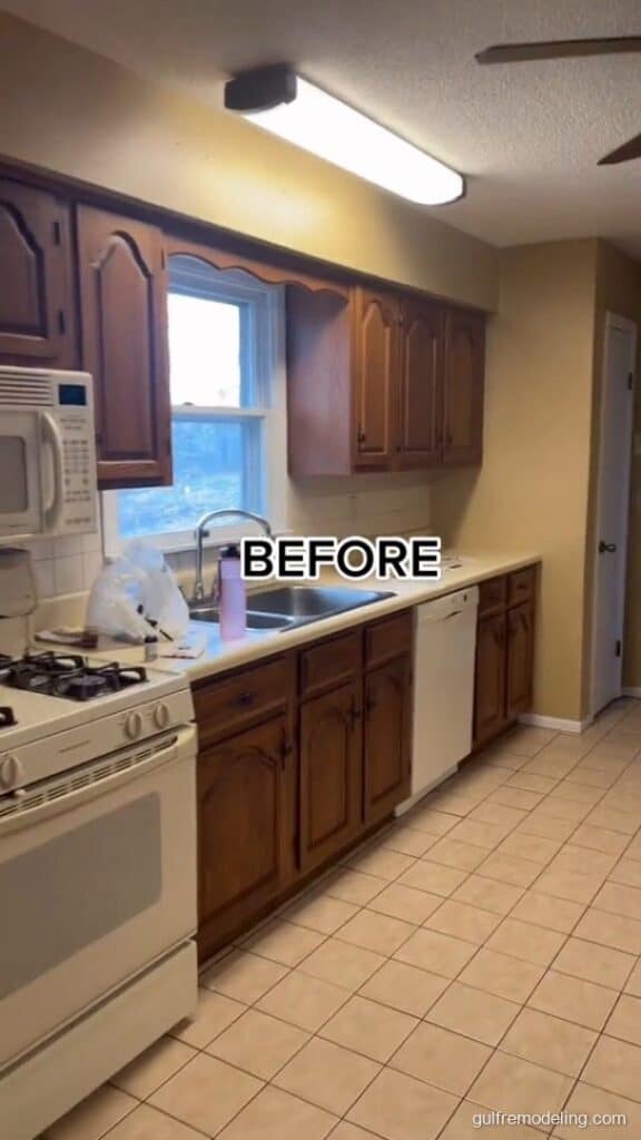 Kitchen before the remodel: old wood cabinets and tile floor