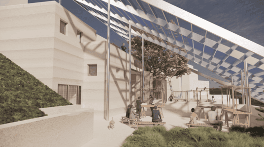 Rammed earth community courtyard with solar panel canopy, seating, tree, and playful shade patterns.