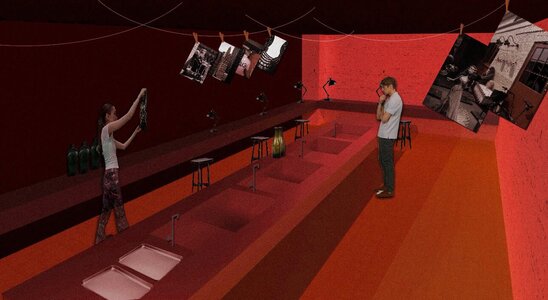 Analogue film darkroom under red safelight with drying black-and-white prints and photographers.