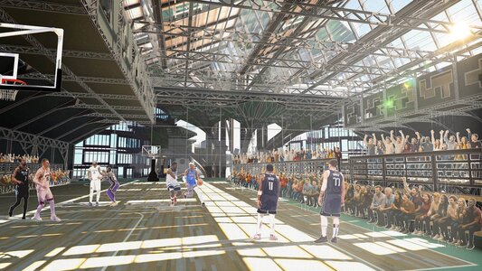 Sunlit basketball game in converted industrial arena with skylights, crowd, and fast break action.