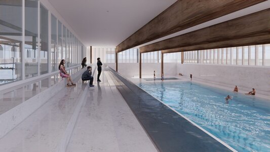 Minimalist indoor lap pool with timber beams, natural light, clerestory windows, and swimmers.