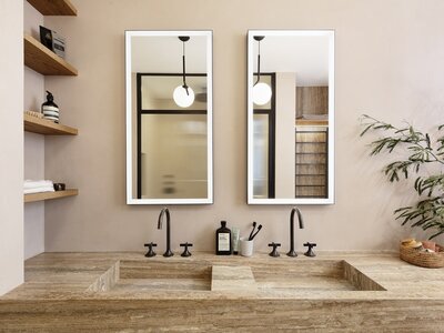Modern minimalist bathroom with double vanity, stone countertop, matte black fixtures, and natural decor.