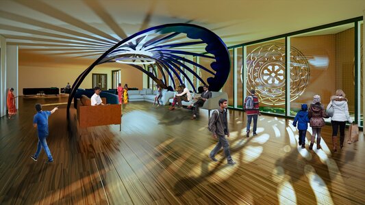 Sunlit contemporary lobby with wooden floors, sculptural blue canopy, reception desk, and patterned glass screen.