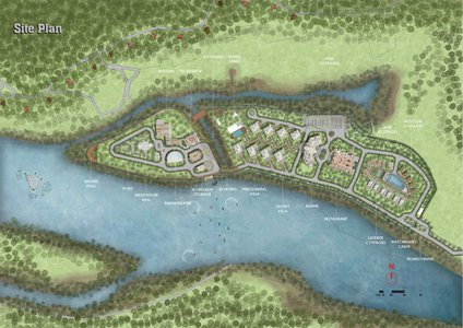 Waterfront community development site plan showcasing integrated buildings, green spaces, and natural landscapes.