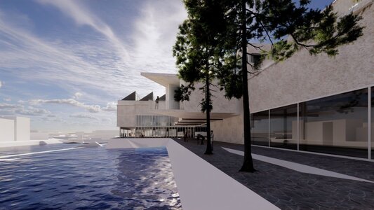 Modern waterfront promenade beside cantilevered cultural centre with glass facade and sawtooth roof.