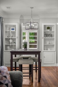 Bright interior featuring elegant lighting, stylish decor, and hardwood flooring for a cozy home vibe.