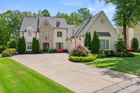 Modern upscale house featuring beautiful landscaping and curb appeal.