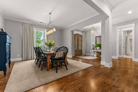 Spacious living area with beautiful hardwood flooring and modern decor.