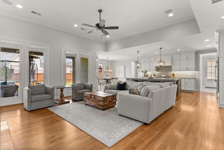 Bright, spacious living area with contemporary decor and hardwood floors.