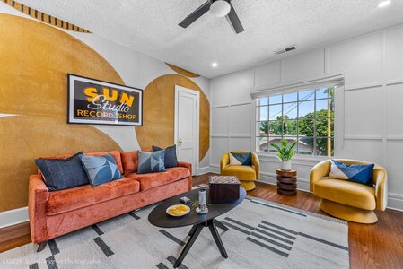 Sun Studio recording room with cozy seating and vibrant decor.