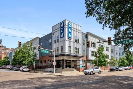 Spacious apartment complex at the intersection of S Front St and Dr. M. L. King, featuring contemporary design.