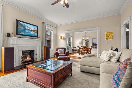 Bright living room featuring fireplace, comfortable sofa, and modern decor, perfect for family gatherings.