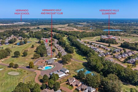 Aerial view of Hernando County neighborhoods featuring golf courses, tennis courts, and schools.