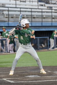 Young baseball athlete ready to swing at the pitch.