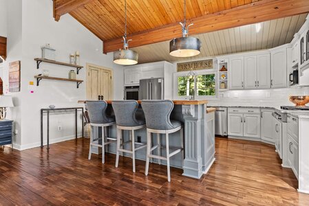 Bright kitchen featuring farmhouse style decor and functional layout.