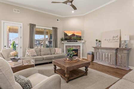Bright living room with neutral tones, fireplace, and stylish furniture for comfort and relaxation.