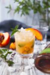 The classic mint julep gets a twist with this mouth-watering Peach Julep!