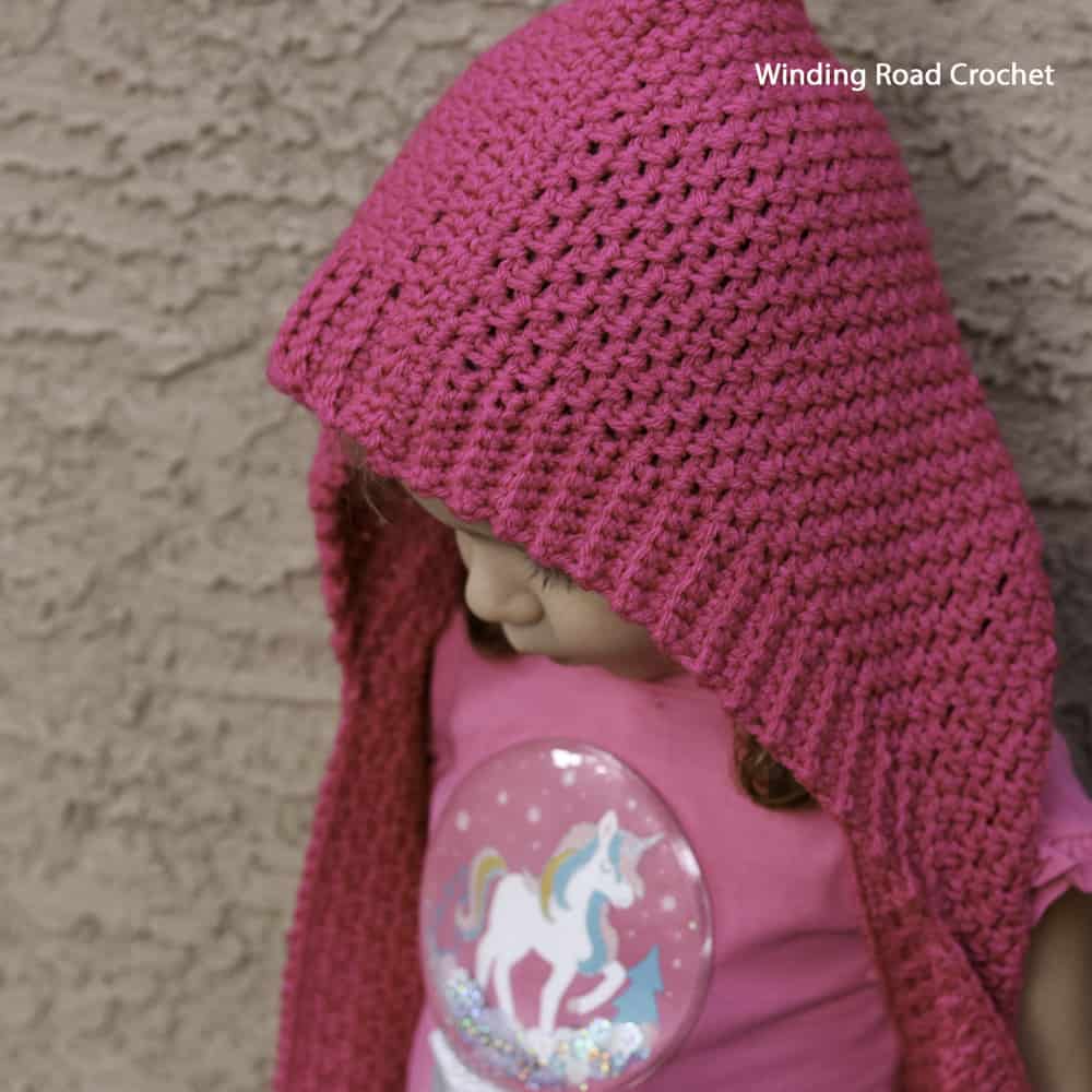 The Hinterlands Hooded Crochet Scarf in a free easy crochet pattern for a scarf with a hood and pockets. Sizes include toddler through adult.
