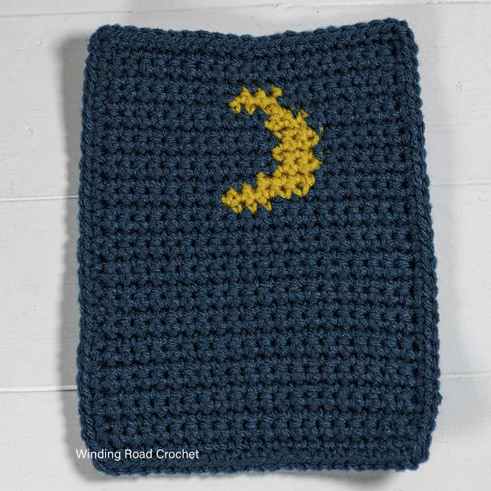 Use up your scrap yarn while crocheting this Winter Village Crochet Afghan. The free crochet pattern provides instructions for many sizes.