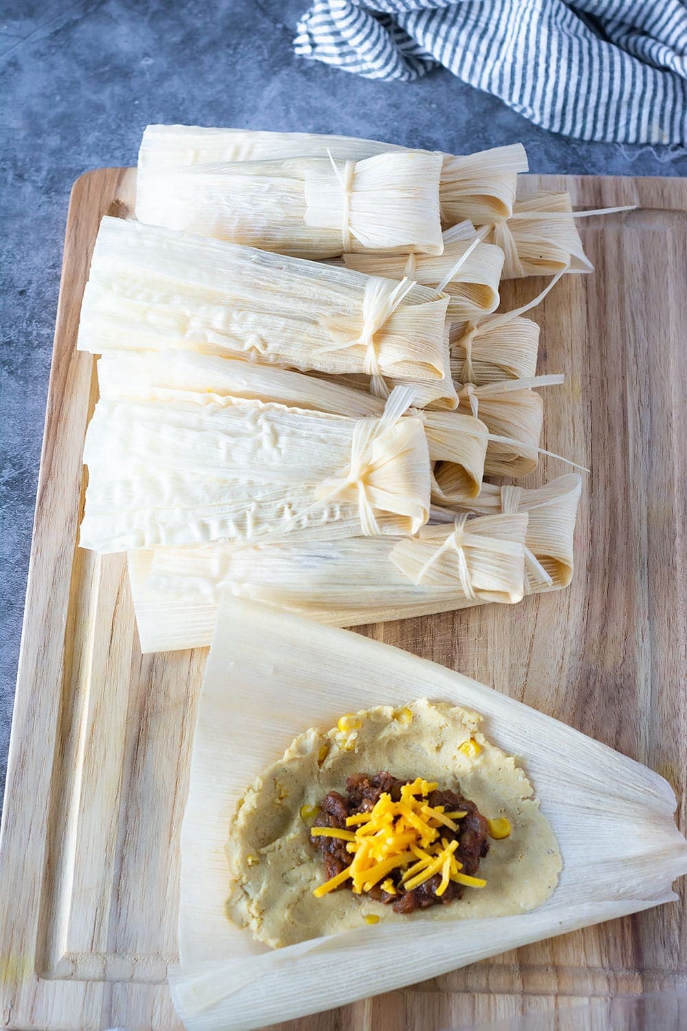 Vegan Tamales Healthier Steps Holding an open softened corn husk in one hand, spread about 2 tablespoons of the dough on the husk beginning 1 inch from the wider top and ending at least 1 1/2 inches open a tamal and check for doneness; vegan tamales
