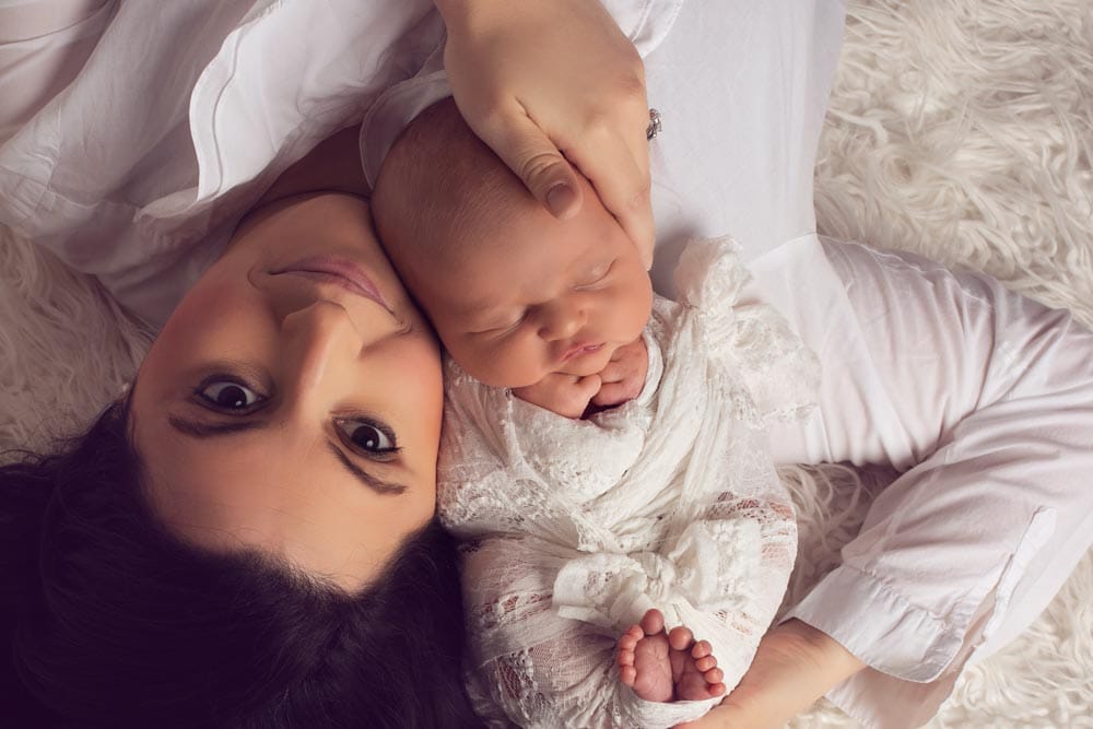 Mother with baby girl at family photoshoot