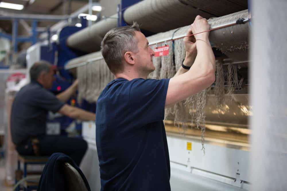 Manufacturing image of 2 men at a carpet factory