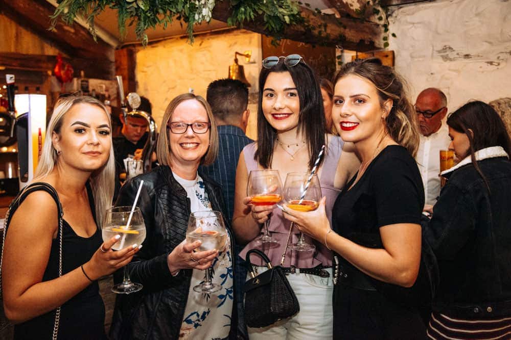 a group of friends enjoying a drink at park house barn