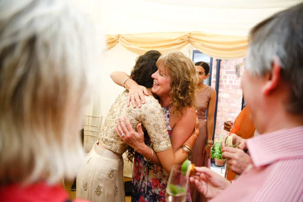 mehndi celebration hug at a party