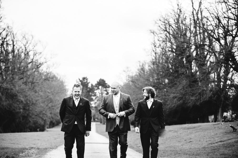 groomsmen at the entrance to soughton hall