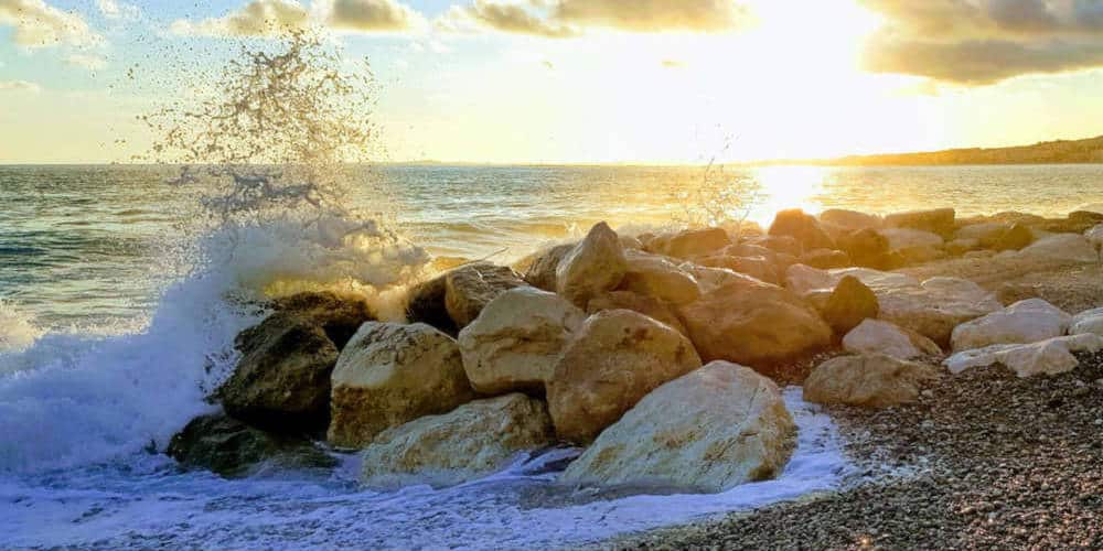Waves crashing in at the beach of Nice