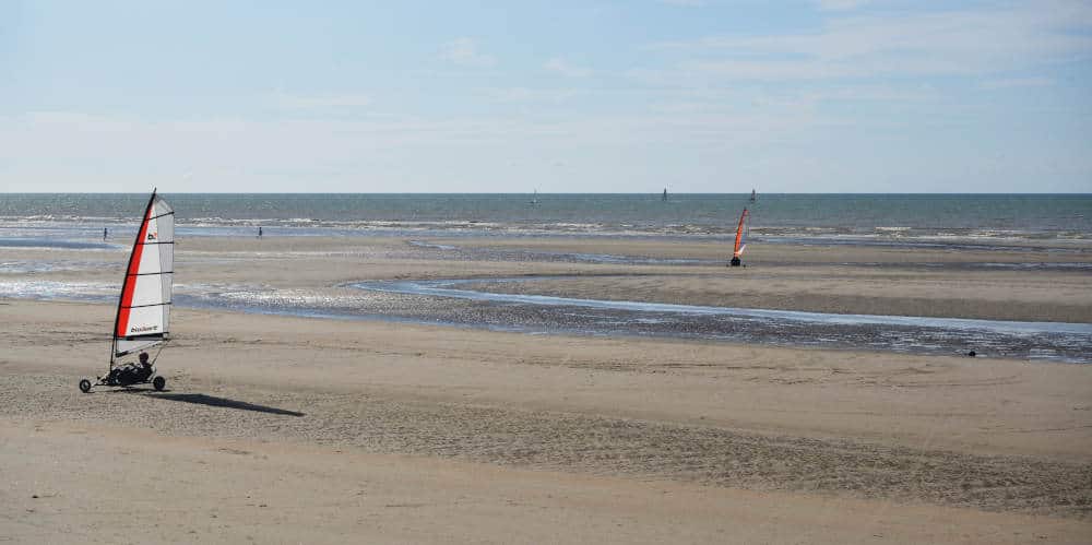 Car sailing on the beach in De Panne