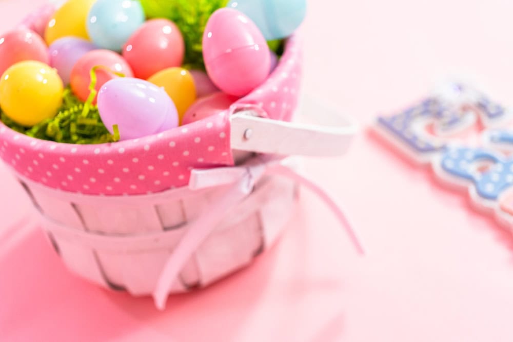 Photo of an Easter basket filled with plastic eggs.
