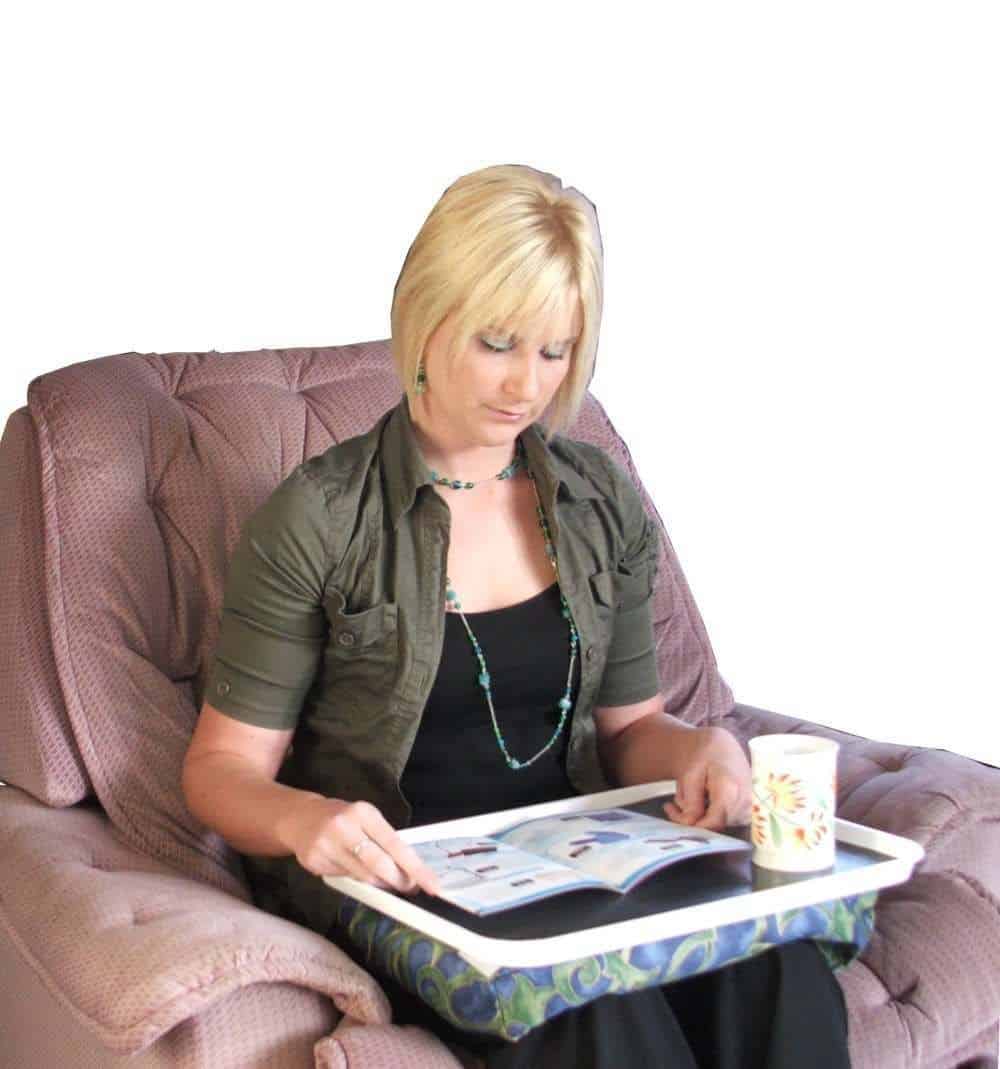 Lady using a laptop tray - daily aids for the elderly or limited mobility