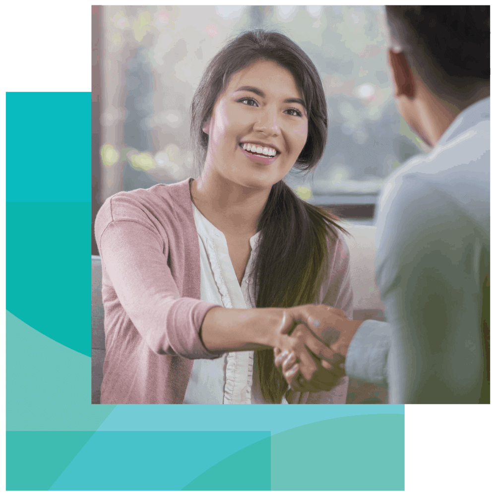 EAP counselor shakes hands a BALANCE financial coach trainer An EAP counselor shakes hands with a BALANCE financial coach trainer
