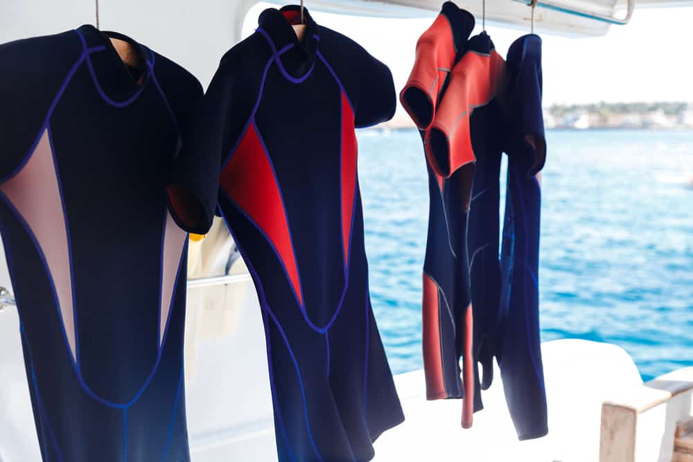 Wetsuits drying after a scuba dive