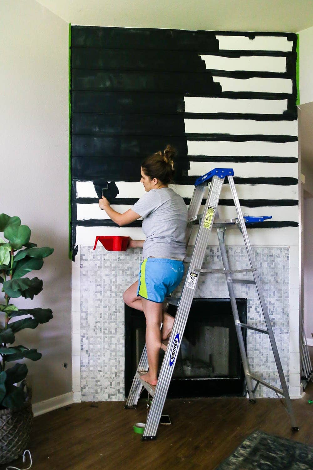 painting shiplap on fireplace