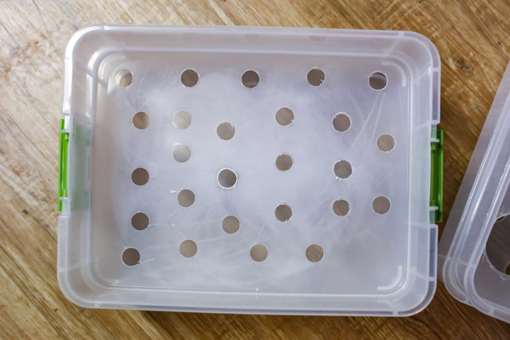storage bins with holes to sort LEGO bricks