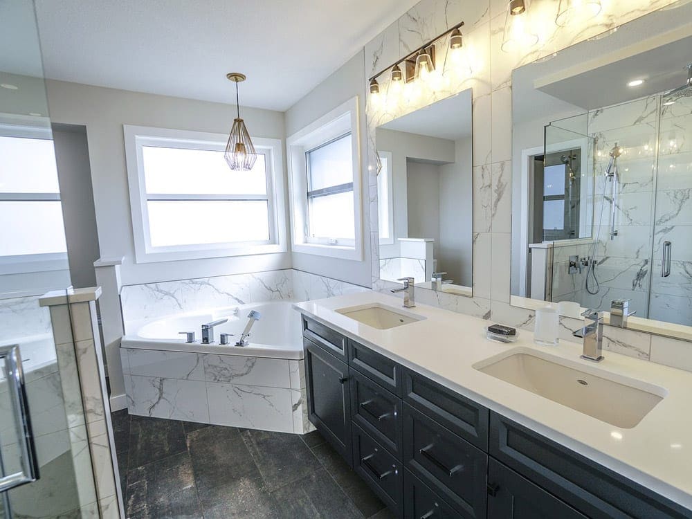 Modern bathroom with stand alone bathtub, walk in shower, and natural stone Modern bathroom with stand alone bathtub, walk in shower, and natural stone