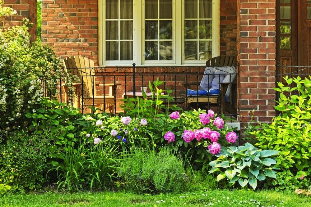 BRICK AND IRON TOUCH PORCH GARDEN DESIGN IDEAS