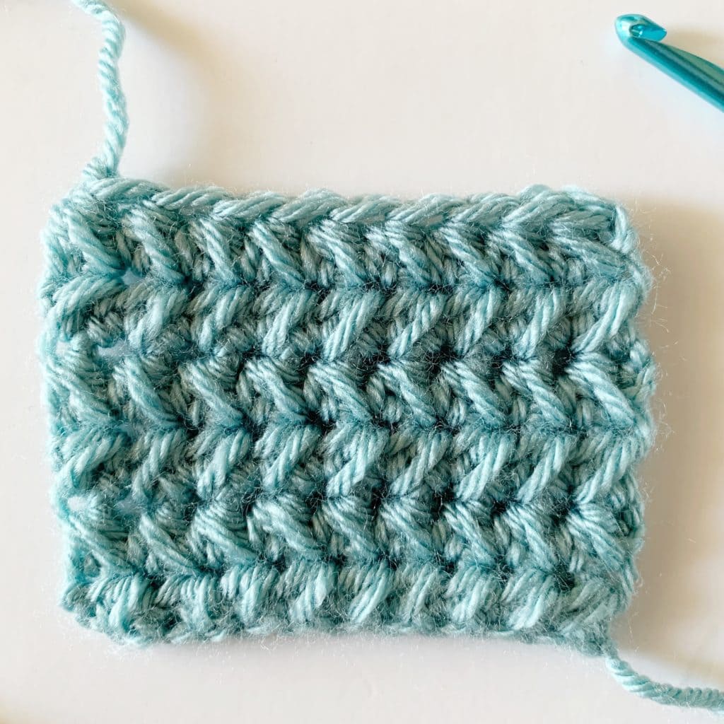 Half Double Crochet Cluster (across two stitches)