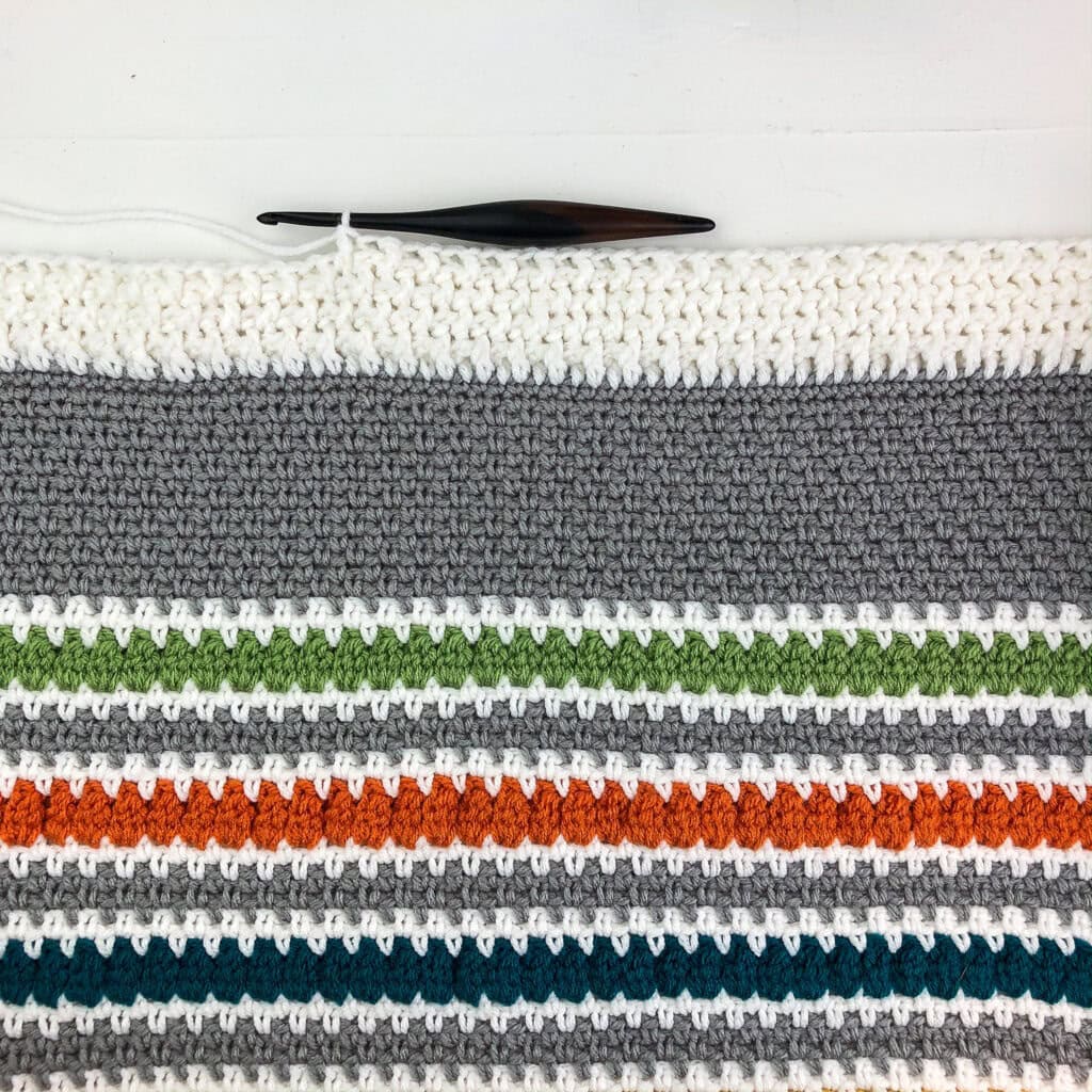 This crochet blanket border has a beautiful textured stitch. Follow this video tutorial or written pattern to learn how to make this border.