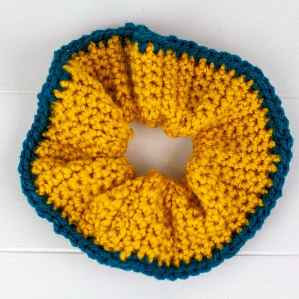 You can make these beginner-friendly crochet scrunchies in about ten minutes. Quick, easy and free crochet pattern with video tutorial.