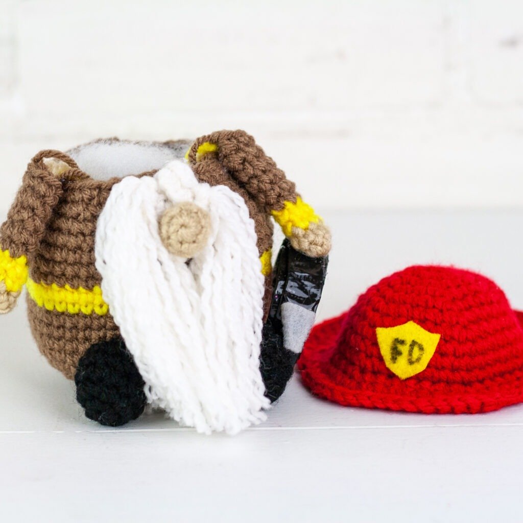 Crochet a firefighter gnome with this free crochet pattern. This is one of many of my profession gnomes series. This gnome makes a perfect gift.