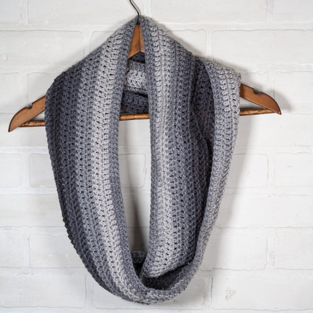 This free crochet pattern is perfect for beginners. This crochet ombre scarf pattern is easy to follow and makes a perfect quick and easy gift.