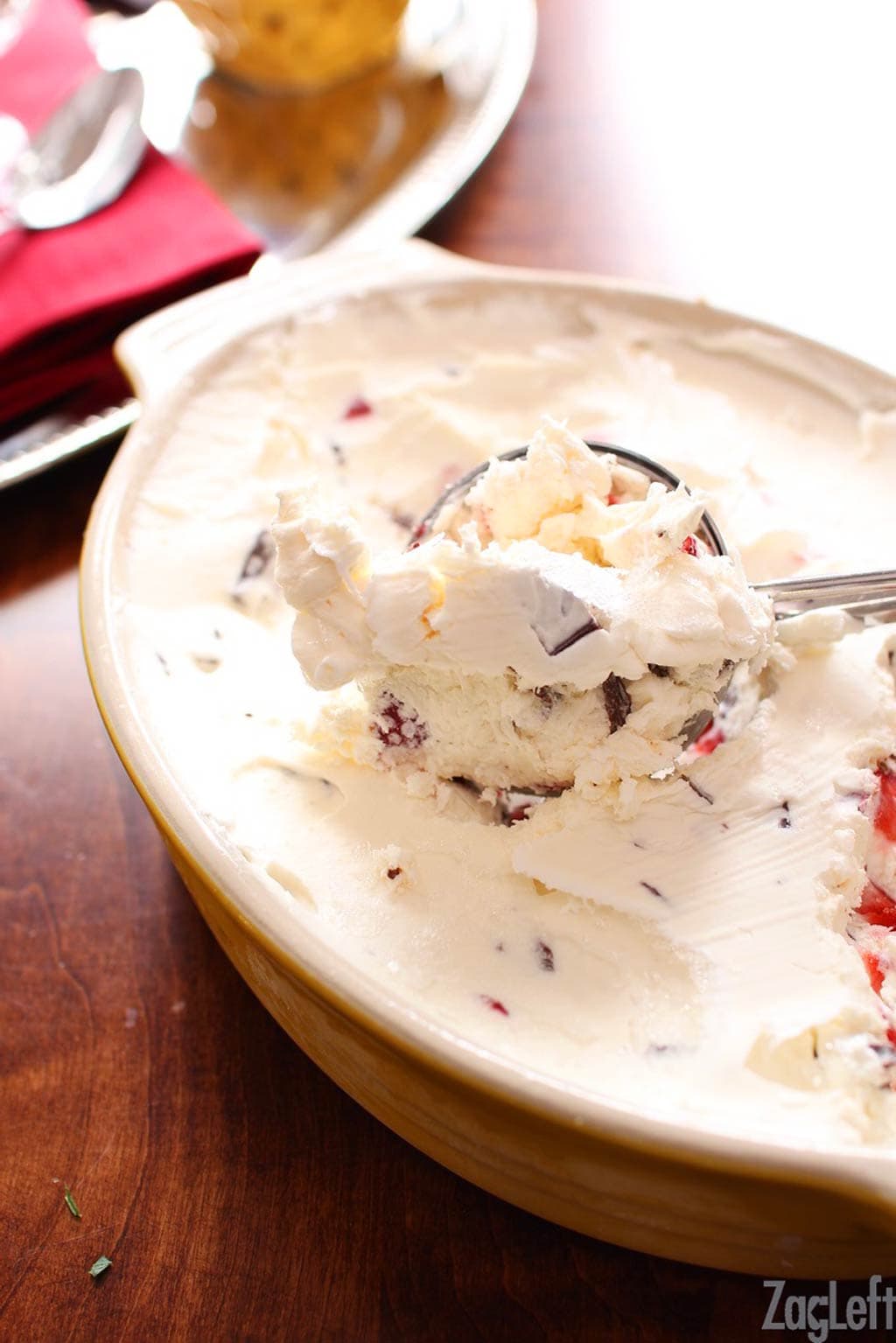 Strawberry Chocolate Ice Cream being scooped from a dish with an ice cream scoop