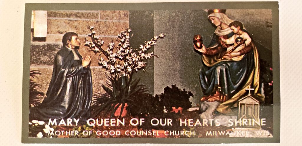 statue of St Louis de montford kneeling near statue of Mary holding Jesus