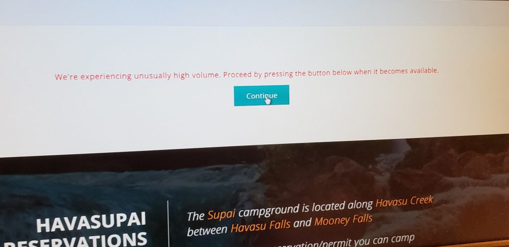 Photo of computer screen with Havasupai Reservations message: We're experiencing high volume