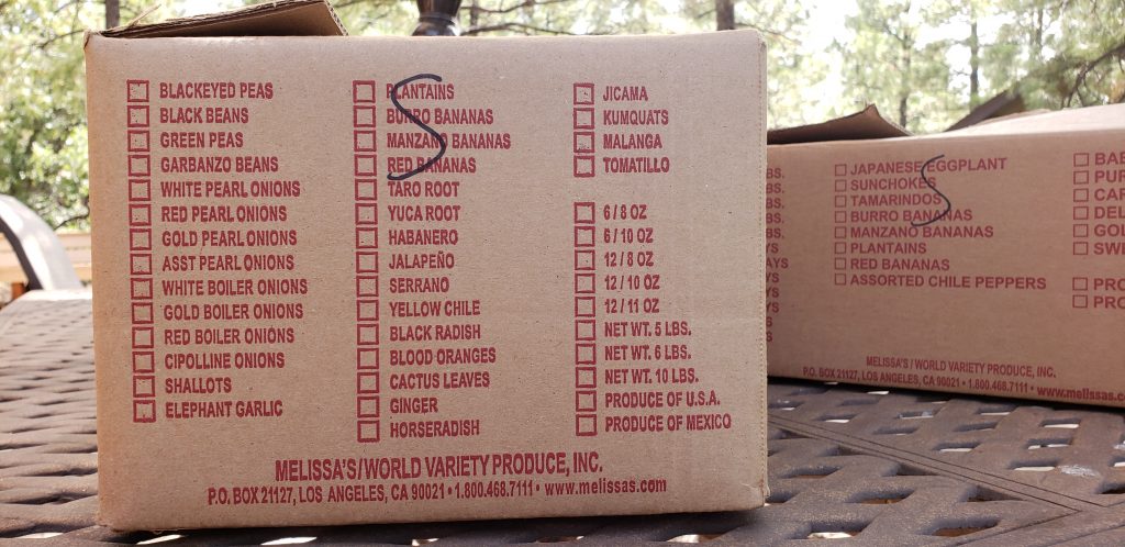 produce box printed with a list of exotic produce
