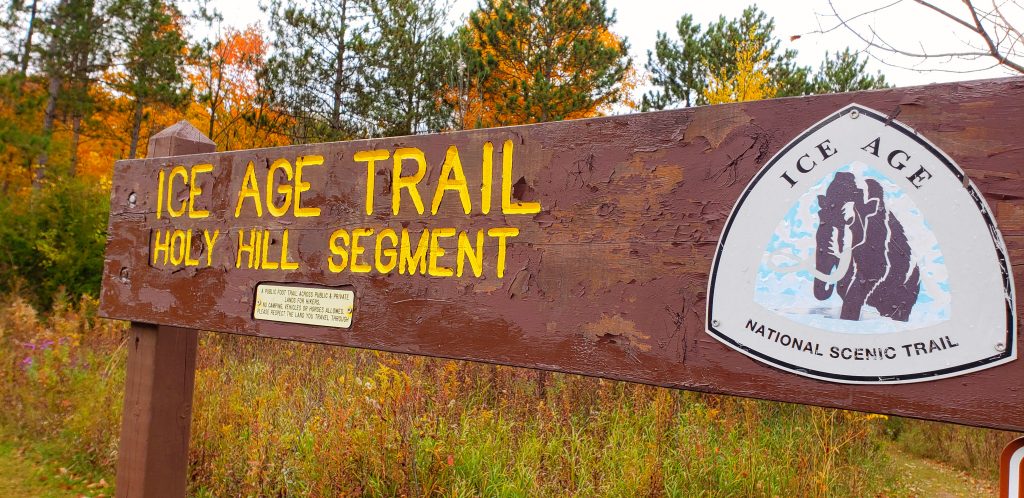 close-up of sign reading "Ice Age Trail Holy Hill segment" on the way to Holy Hill WI